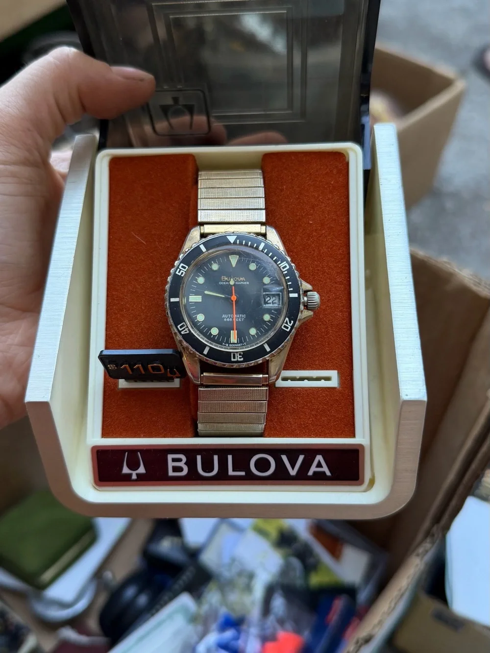 Bulova Silver Watch with Black Dial and Orange Accents